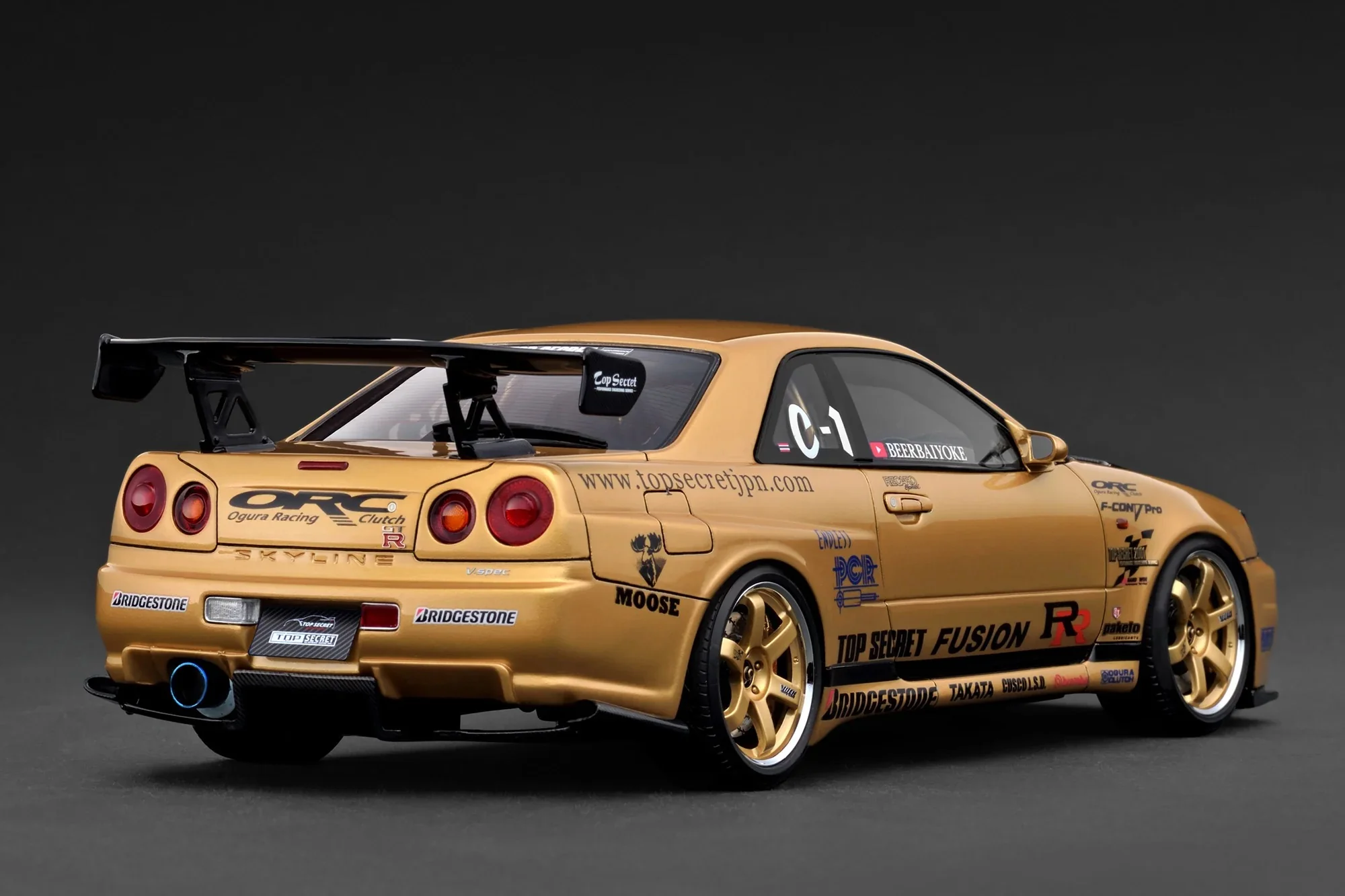 Ignition-Model Nissan Skyline GT-R R34 (BNR34) Top Secret Thailand 34GT-R Gold 1:18 - Image 2