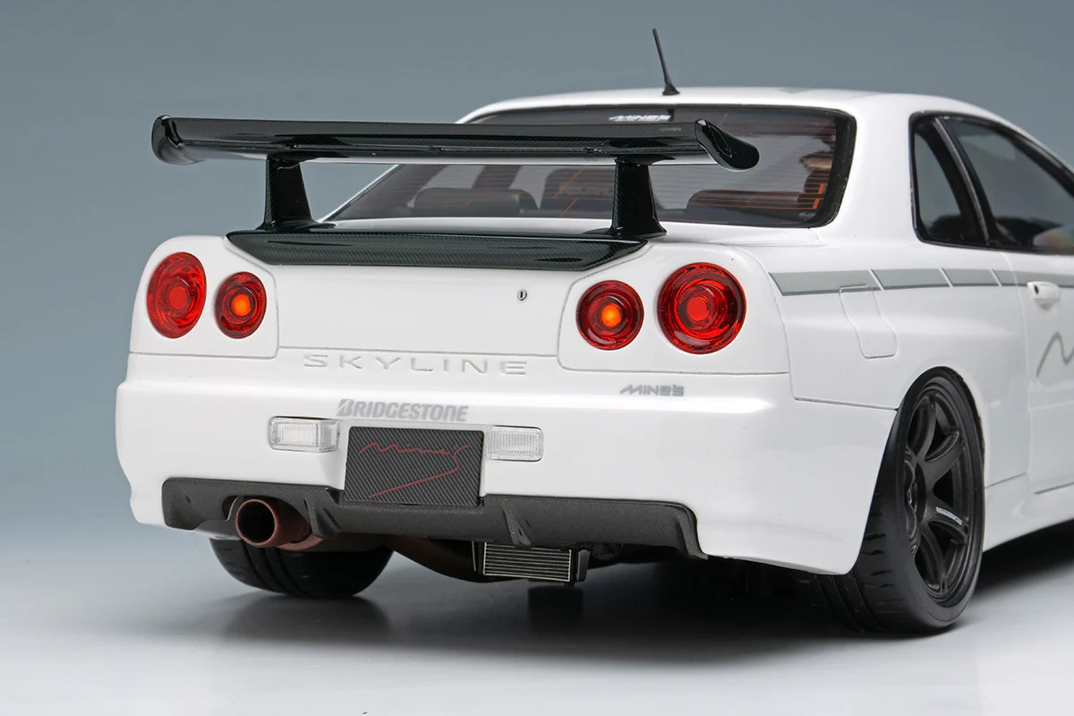 Make Up Co., Ltd / Eidolon Nissan Skyline GT-R (BNR34) V-spec N1 "Mine's" White WITH DISPLAY 1:18 - Image 9