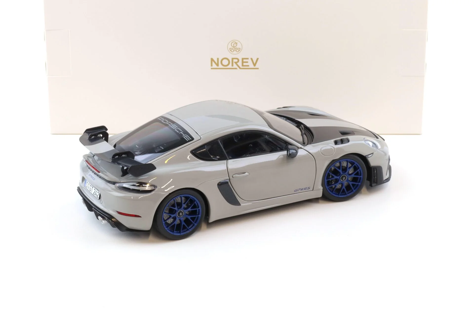 Norev 2023 Porsche 718 Cayman GT4 RS w/ Weissach Package Chalk w/ Blue Wheels 1:18 - Image 3