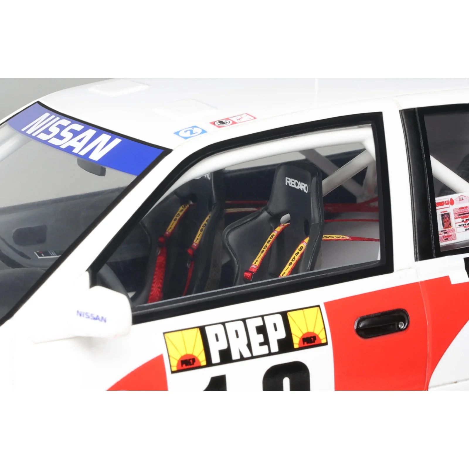Otto 1992 Nissan Sunny GTi-R Team Nissan Motorsport Europe No 12 Rally Montecarlo White Red Blue 1:18 - Image 8