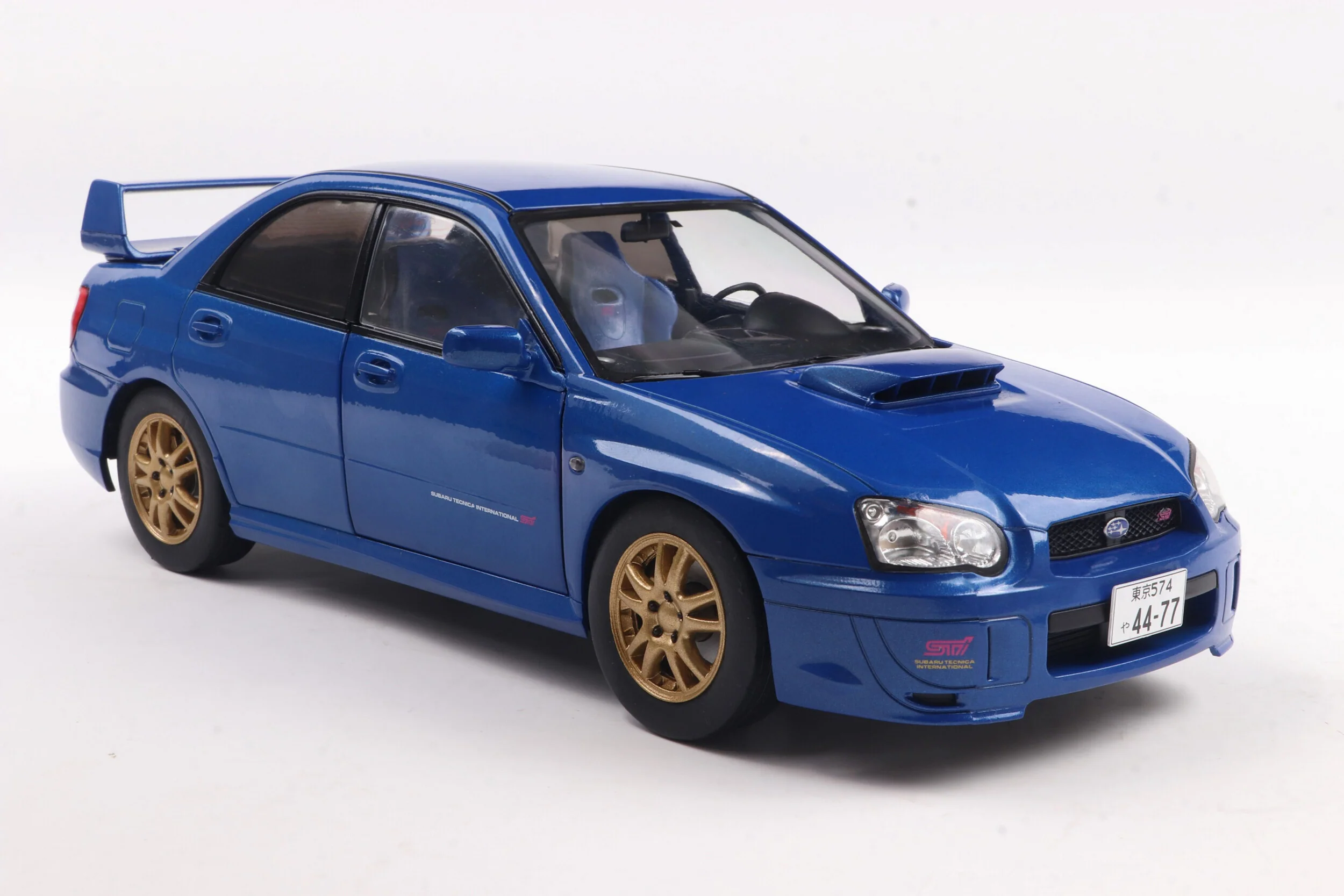 Solido 2003 Subaru WRX STi (GDB) Sonic Blue w/ Gold Wheels 1:18 - Image 4
